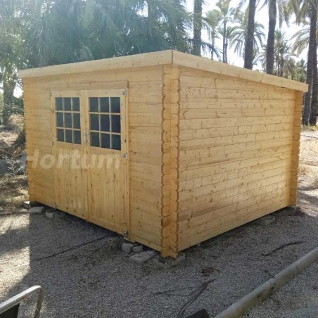 Caseta de madera para jardín con techo a un agua.